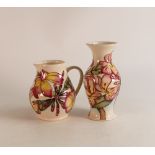 Moorcroft Frangipani vase with matching jug. Height of tallest 19cm