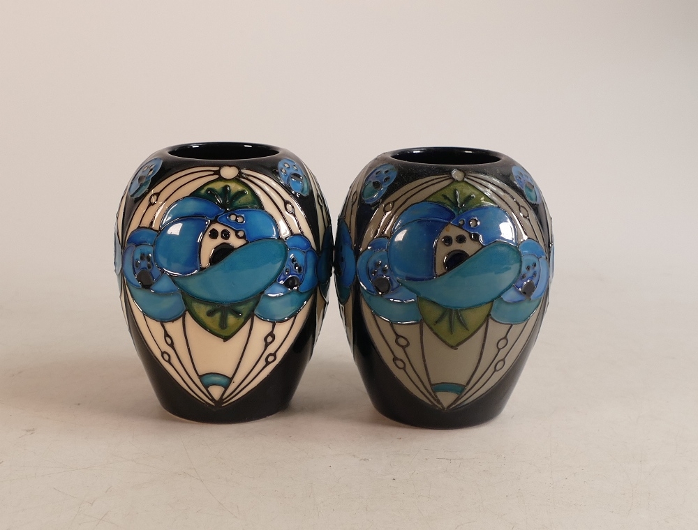 Two Moorcroft Rennie blue rose vases in slightly different colourways. Height 10cm