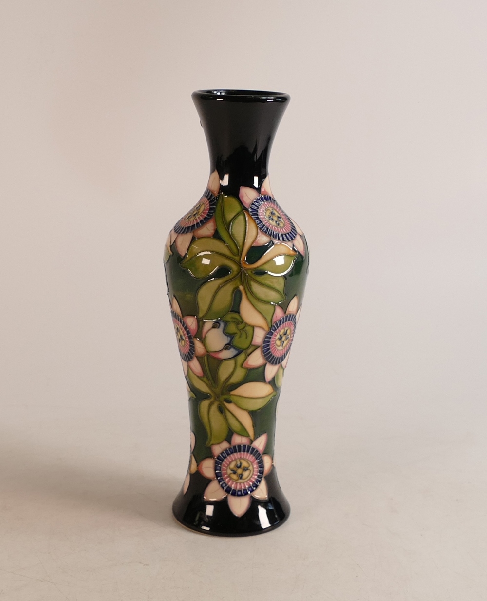 Moorcroft trial vase with pink and blue flowers and large leaves on dark blue ground, dated 13/7/15,