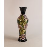 Moorcroft trial vase with pink and blue flowers and large leaves on dark blue ground, dated 13/7/15,