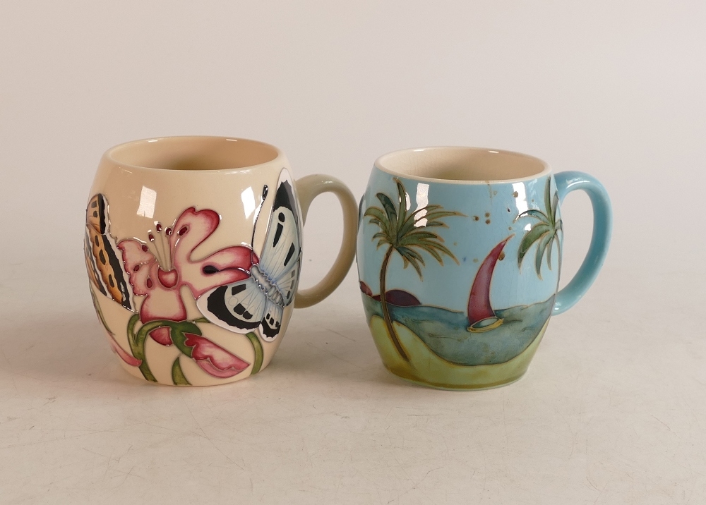 Two Moorcroft barrel mugs to include Caribbean (crazed ) and Butterflies (2)