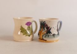 Two Moorcroft mugs to include Thistle (crazing and staining inside) and Palm Tree (2)