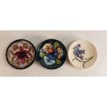 Three Moorcroft pin dishes to include Bluebell Harmony, Triple Choice (M.C.C, seconds) and