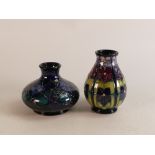 Two Moorcroft violets vases. Height of tallest 12.5cm(squat vase crazing) (2)