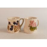 Two Moorcroft Mugs to include pink flowers on white ground and blackberry designed mug (2 )