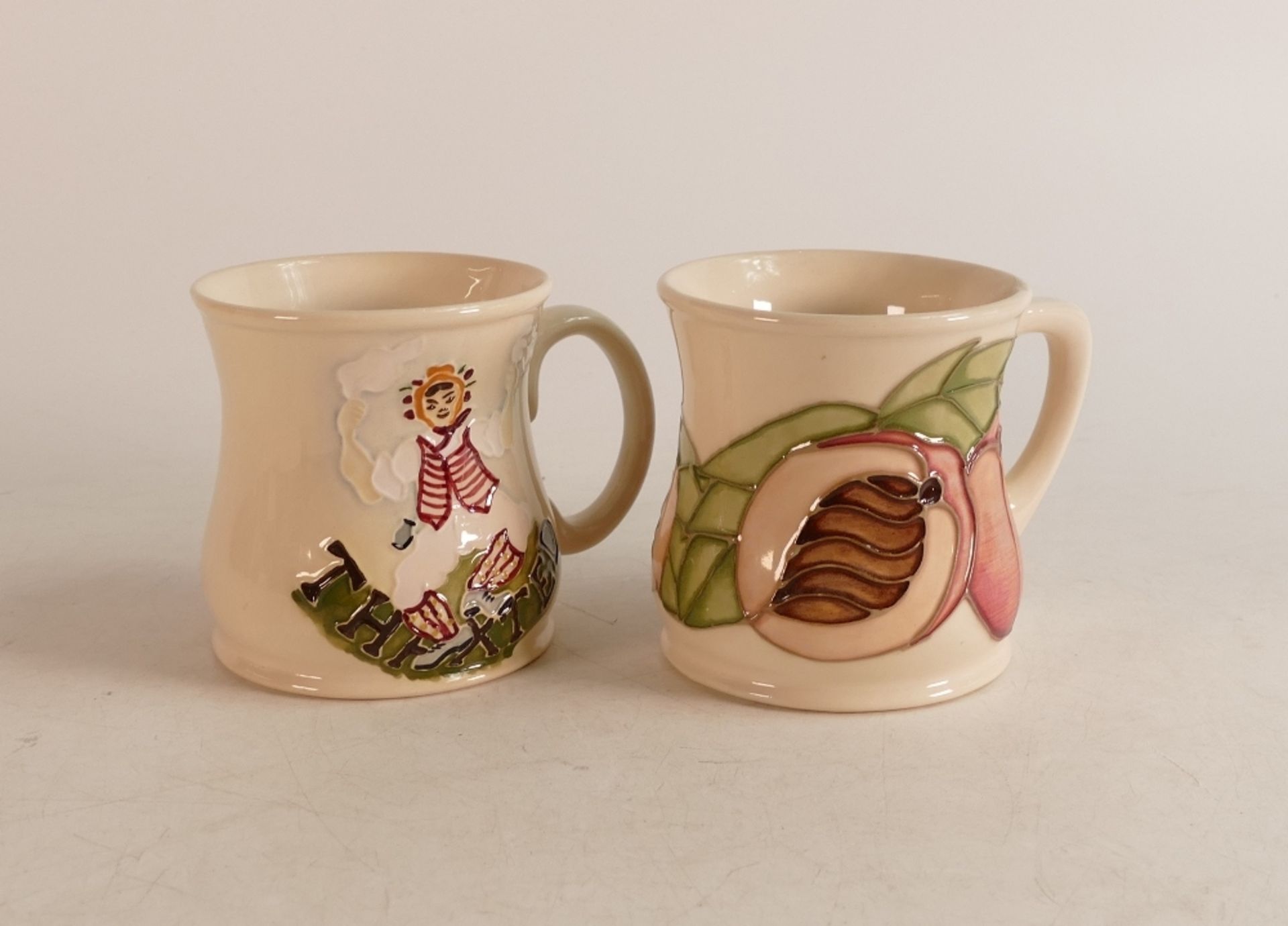 Two Moorcroft mugs to include Apricot and Thaxted cottage (2)