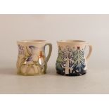 Two Moorcroft mugs to include MCC 2001 and Christmas woods (2)