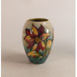 Early Moorcroft Dalia vase on faded green ground. Height 12.5cm