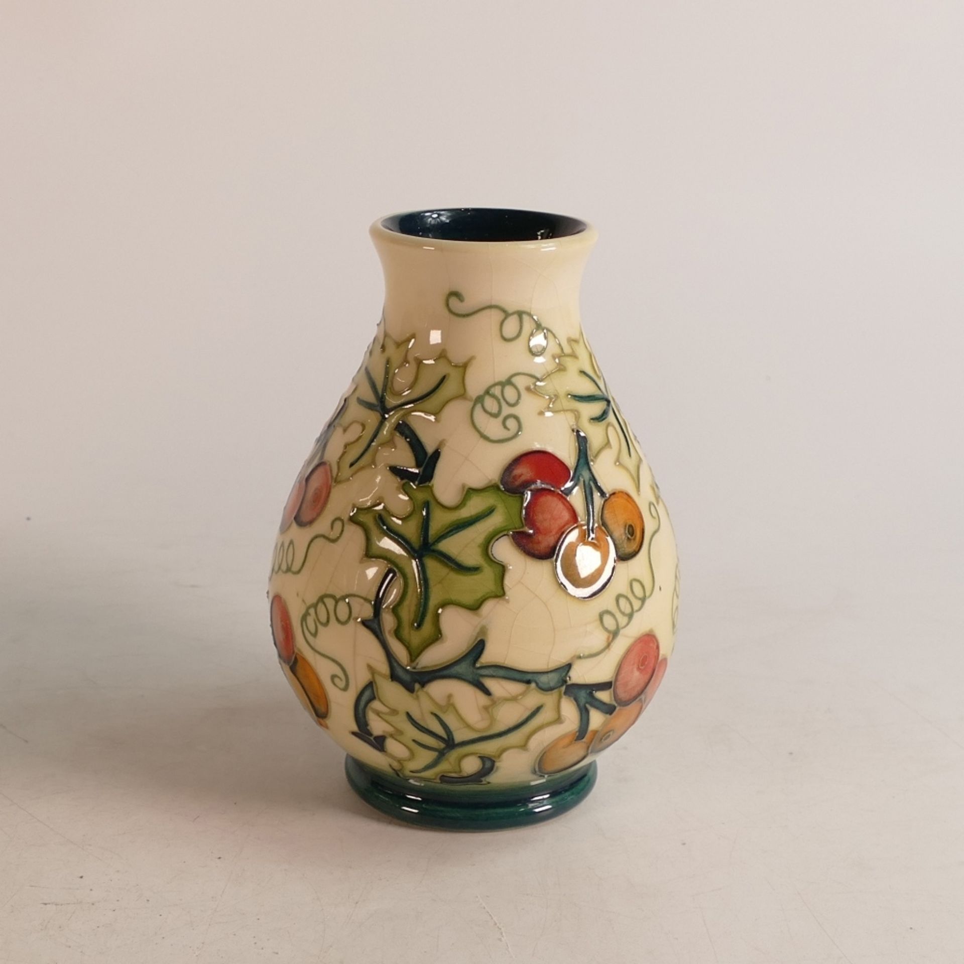 Moorcroft vase in the 'Holly Berries' pattern, signed by John Moorcroft and dated 1996, 14cm