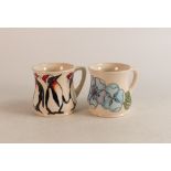 Two Moorcroft mugs to include Blue Pansy and Christmas Penguins (2)