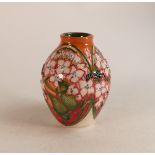 Moorcroft Trial vase decorated with pink flowers on orange background. Height 15cm