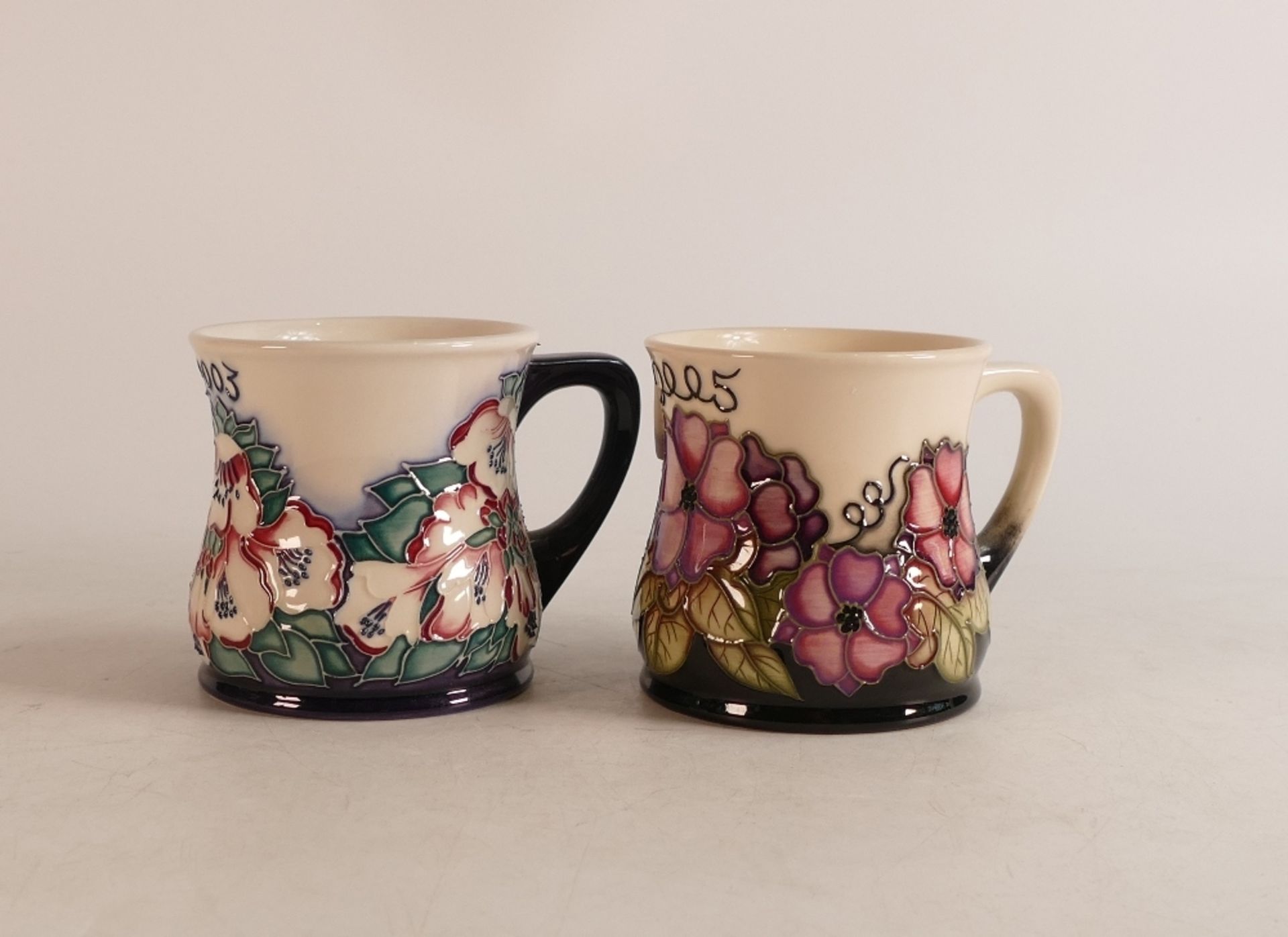 Two Moorcroft mugs to include Personalised mug for peter and 2003 year mug (2)