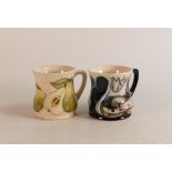 Two Moorcroft mugs to include Pears and M.C.C 2007 (2)