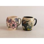 Two Moorcroft mugs to include Lamia and M.C.C 1998 (2)