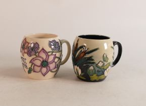 Two Moorcroft mugs to include Lamia and M.C.C 1998 (2)