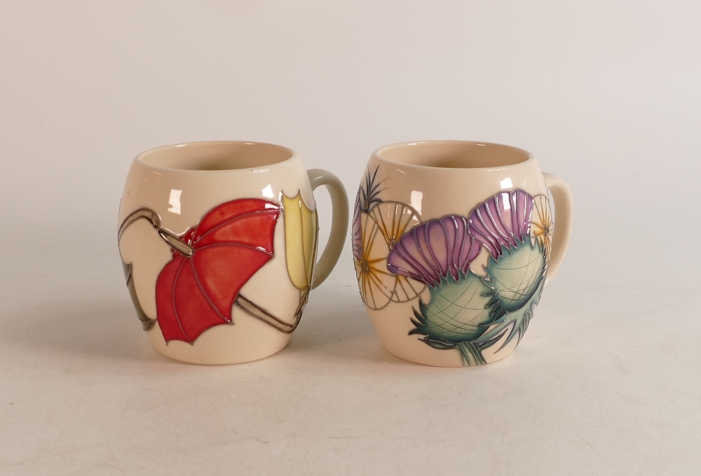 Two Moorcroft mugs to include Thistle and Umbrellas (2)