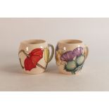 Two Moorcroft mugs to include Thistle and Umbrellas (2)