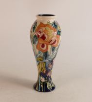 Limited edition Moorcroft baluster vase decorated with various wild flowers on blue/yellow faded