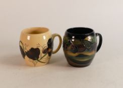 Two Moorcroft mugs to include Trail Chocolate Cosmos dated 12/1/15 together with Western Isles. Both