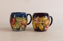 Two Moorcroft mugs to include Endangered Species and Tiger Lilly (2)