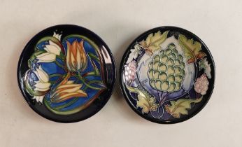 Two Moorcroft Pin Dishes to include grape vine patterned and wild flowers on blue ground (silver