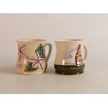 Two Moorcroft mugs to include Moorcroft factory and 1999 year mug (2)