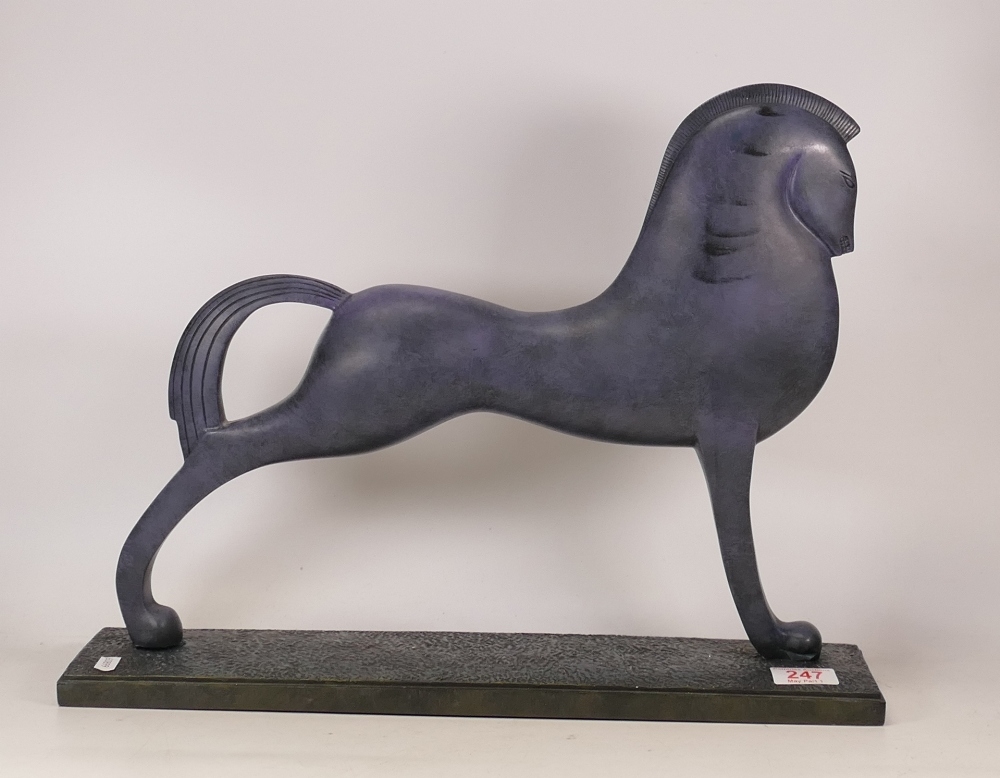 A sculpture of a contemporary horse finished in antique bronze patina . Length 49cm