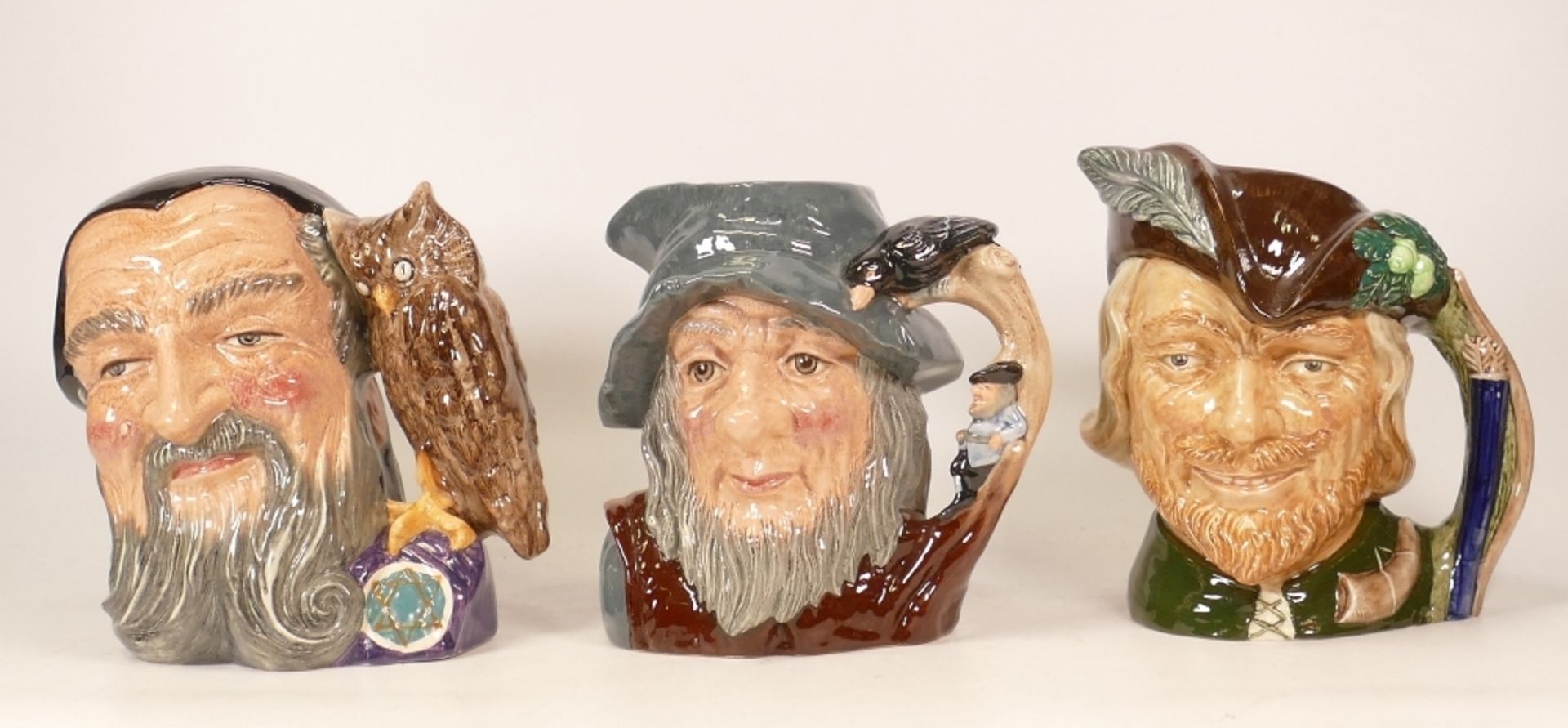Three Royal Doulton Character Jugs to include Robin Hood D6527, Rip Van Winkle D6438 and Merlin