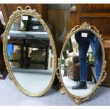 Two Gilt Framed Oval Mirrors in the rococo style. Heoght of tallest: 75cm (2)