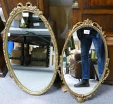 Two Gilt Framed Oval Mirrors in the rococo style. Heoght of tallest: 75cm (2)