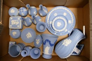 A large collection of Wedgwood Blue Jasperware including vases, pin trays, lidded boxes, wall plates