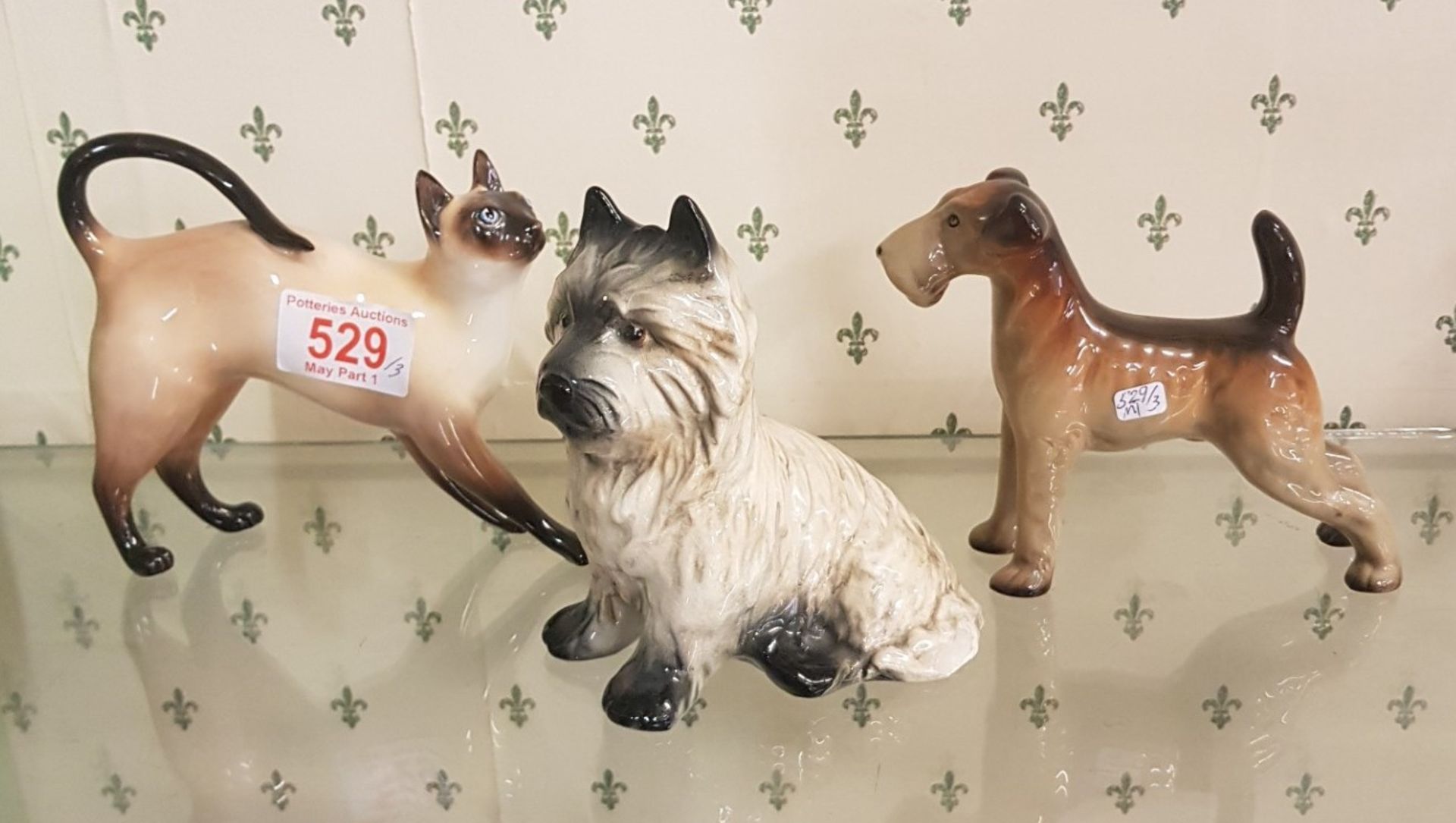 Three Animal Figures to include Royal Doulton Siamese Cat, Sylvac Cairn Terrier 3447 and Midwinter