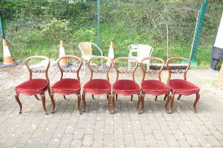 A Set of Six Victorian Balloon Back Dining Chairs with Red Upholstery and Carved Rococo Back.