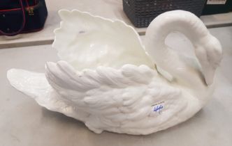 A large ceramic planter in swan form, possibly Spode, 46cm in length, with cracks and nibbles.