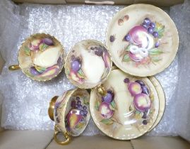 A Collection of Aynsley Orchard Gold Teaware to include Three Teacups and Saucers and One Small
