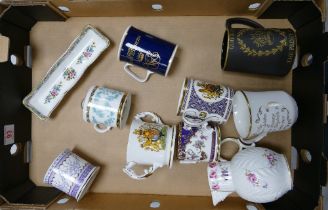 A mixed collection of items to include commemorative loving cups , Coalport Caughley mask head jug ,