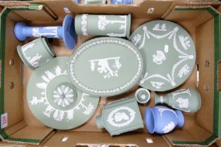 A collection of Wedgwood Jasperware to include tea caddy, vases, candlestick, dressing table tray,