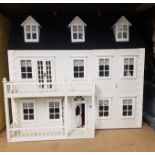 Large 3 story dolls house in grey, 72cm in width.