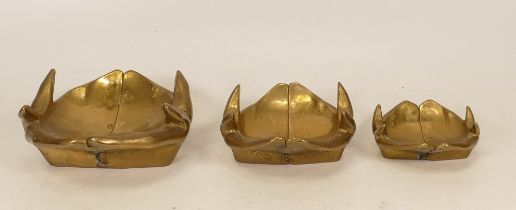 Set of three graduated brass shallow bowls
