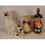 A 19th century King Charles Spaniel ceramic dog together with courting couple vase, lamp toby jug (