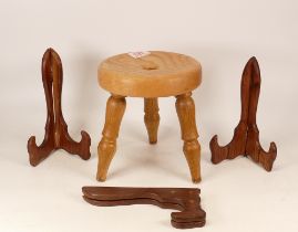 Small wooden three legged stool together with 3 wooden plate stands