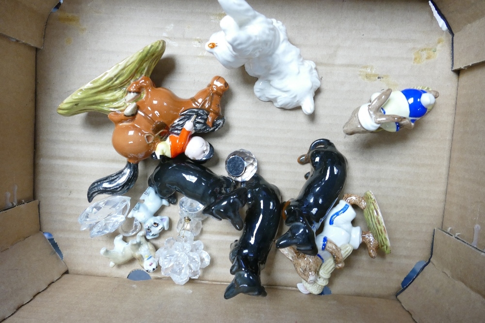 A mixed collection of items to include Royal Doulton Bunnykins Figures, Beswick Dachshund dogs, Wade