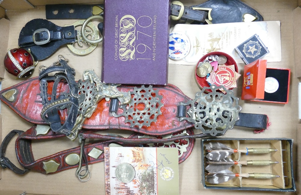 A mixed collection of items to include Horse brasses, collectable coins & badges etc