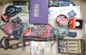 A mixed collection of items to include Horse brasses, collectable coins & badges etc