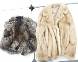 One Mink Fur Coat together with a Silver Fox Cape. To the inside of Mink Fur example is