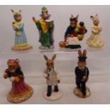 A collection of 7 Royal Doulton Bunnykins figures to include Old Balloon seller DB217, Mystic DB197,