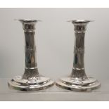 Pair of Sterling silver weighted candle stick holders, Sheffield 1901, total weight 729.5g.