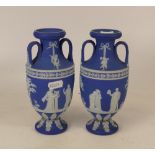 Two Wedgwood Dip Blue twin handled vases (one a/f)