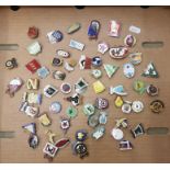 A collection of 60+ Speedway badges (1 tray).