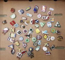 A collection of 60+ Speedway badges (1 tray).